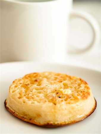 Toasted crumpet with butter Stock Photo - Premium Royalty-Free, Code: 659-01848317