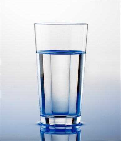 Glass of water standing on water Stock Photo - Premium Royalty-Free, Code: 659-01848343