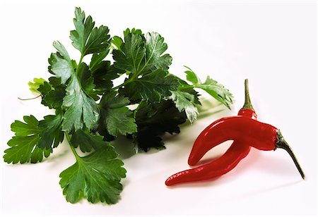simsearch:659-01843546,k - Parsley and two chili peppers Stock Photo - Premium Royalty-Free, Code: 659-01848460