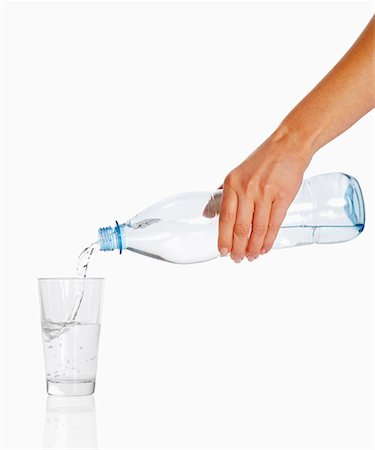 simsearch:659-01848940,k - Woman's hand pouring water Foto de stock - Sin royalties Premium, Código: 659-01849043