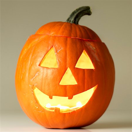 pumpkin carving - Lit Halloween pumpkin Stock Photo - Premium Royalty-Free, Code: 659-01849197