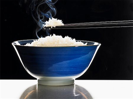 A bowl of steaming rice Stock Photo - Premium Royalty-Free, Code: 659-01849316