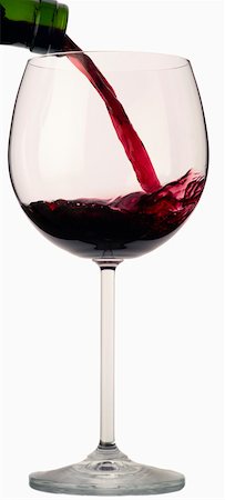 pouring wine glass - Red wine being poured into a red wine glass Stock Photo - Premium Royalty-Free, Code: 659-01849349