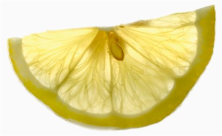 single lemon - Half a slice of lemon Stock Photo - Premium Royalty-Free, Code: 659-01849354