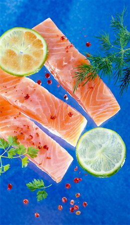 simsearch:659-06153430,k - Several salmon fillets on blue background Fotografie stock - Premium Royalty-Free, Codice: 659-01849482