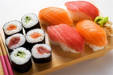 Maki sushi and nigiri sushi on sushi board Stock Photo - Premium Royalty-Free, Code: 659-01849651