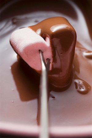 dunking food - Chocolate fondue with heart- shaped marshmallow Stock Photo - Premium Royalty-Free, Code: 659-01849719