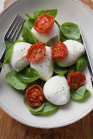 Insalata caprese (Tomatoes with mozzarella and basil) Stock Photo - Premium Royalty-Free, Code: 659-01849839