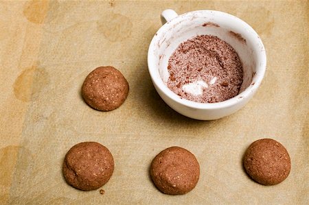 Unbaked hazelnut biscuits, cocoa and sugar mixture Stock Photo - Premium Royalty-Free, Code: 659-01849964