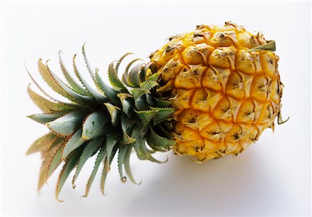 single pineapple - A Whole Pineapple Stock Photo - Premium Royalty-Free, Code: 659-01842215