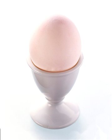 simsearch:659-01850865,k - A White Egg in an Egg Cup Stock Photo - Premium Royalty-Free, Code: 659-01842356