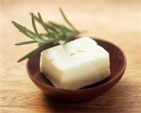 Fresh Butter in a Wooden Bowl with Rosemary Stock Photo - Premium Royalty-Free, Code: 659-01842357