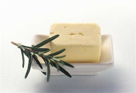 simsearch:659-01842371,k - Fresh Butter in a White Butter Dish with Rosemary Stock Photo - Premium Royalty-Free, Code: 659-01842358