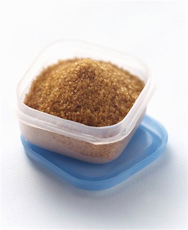 Brown Sugar Crystals in Plastic Storage Container Stock Photo - Premium Royalty-Free, Code: 659-01842361