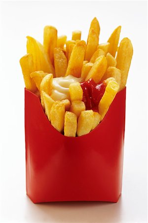 simsearch:659-03531074,k - French Fries in Red Fast Food Box with Ketchup and Mayonnaise Stock Photo - Premium Royalty-Free, Code: 659-01842479