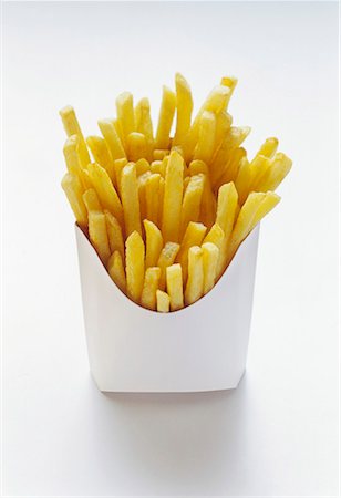 fries white background - Chips in white fast food box Stock Photo - Premium Royalty-Free, Code: 659-01842472