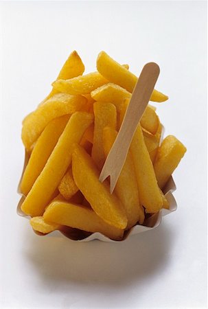 Thick Cut Fries with Wooden Fork Stock Photo - Premium Royalty-Free, Code: 659-01842489