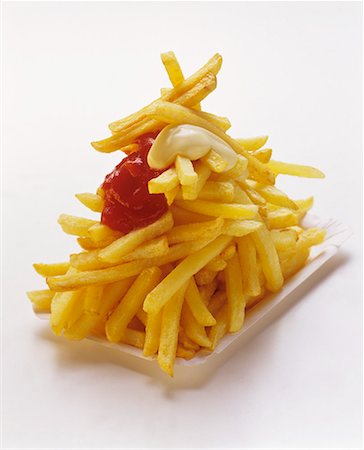 French Fries on a Paper Plate with Ketchup and Mayonnaise Stock Photo - Premium Royalty-Free, Code: 659-01842483