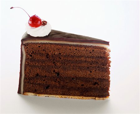 A Slice of Chocolate Layer Cake Foto de stock - Sin royalties Premium, Código: 659-01842576