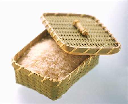 Uncooked Rice in a Covered Basket Stock Photo - Premium Royalty-Free, Code: 659-01842756
