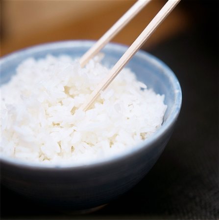 simsearch:659-01842762,k - A Bowl of Cooked White Rice with Chopsticks Stock Photo - Premium Royalty-Free, Code: 659-01842751