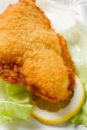 Fish nugget with lettuce leaf and slice of lemon Stock Photo - Premium Royalty-Free, Code: 659-01842911