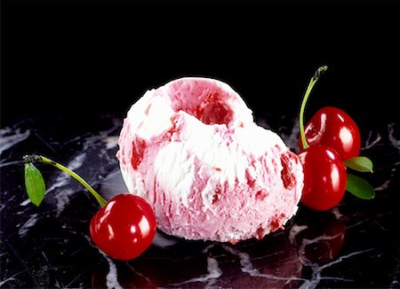 Cherry ice cream with cherries on marble slab Stock Photo - Premium Royalty-Free, Code: 659-01842954