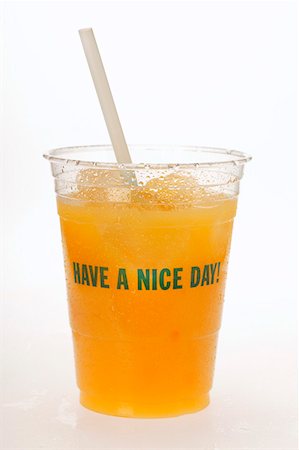 simsearch:659-01864200,k - Orange juice in plastic tumbler with straw Foto de stock - Sin royalties Premium, Código: 659-01843042