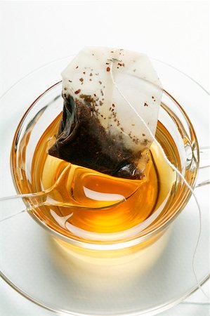 Used tea bag in teacup with spoon Foto de stock - Sin royalties Premium, Código: 659-01843072