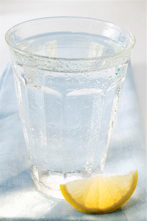 Glass of water and wedge of lemon Stock Photo - Premium Royalty-Free, Code: 659-01843140