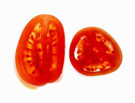 Plum tomato (longitudinal- and cross-sections) Stock Photo - Premium Royalty-Free, Code: 659-01843156
