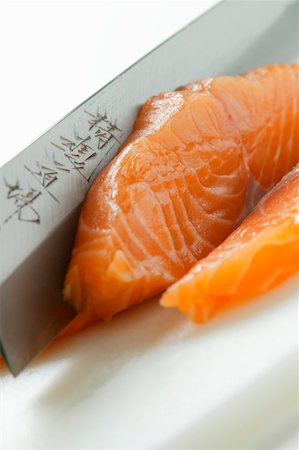 Cutting salmon for sushi Stock Photo - Premium Royalty-Free, Code: 659-01843244