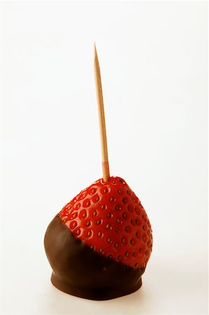 simsearch:659-06372835,k - Chocolate-coated strawberry on toothpick Foto de stock - Sin royalties Premium, Código: 659-01843345