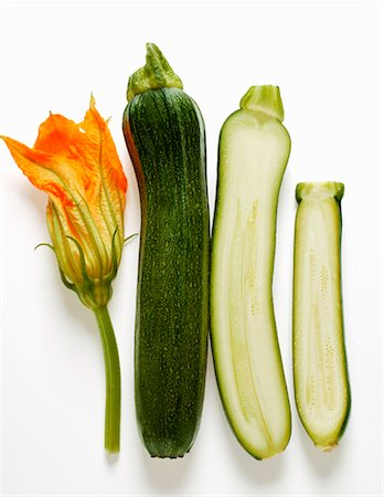edible flower - Courgette flower, whole and half courgettes Stock Photo - Premium Royalty-Free, Code: 659-01843499