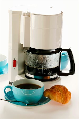 Coffee machine, blue coffee cups and croissant Stock Photo - Premium Royalty-Free, Code: 659-01843534