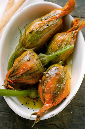 Marinated stuffed courgette flowers Stock Photo - Premium Royalty-Free, Code: 659-01843754