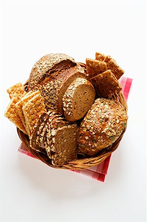 sliced brown bread - Various types of wholemeal bread & crispbread in bread basket Stock Photo - Premium Royalty-Free, Code: 659-01843795