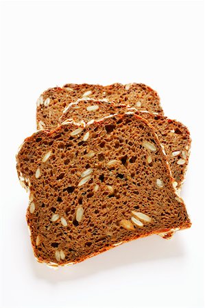 simsearch:659-01866647,k - Three slices of wholemeal bread Foto de stock - Royalty Free Premium, Número: 659-01843793