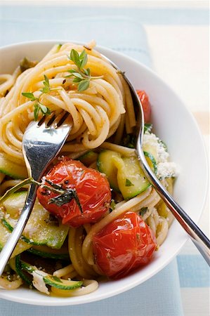 Spaghetti with cherry tomatoes and courgettes Stock Photo - Premium Royalty-Free, Code: 659-01843922