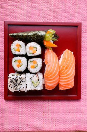 salmon pink - Assorted sushi on red platter Stock Photo - Premium Royalty-Free, Code: 659-01843948