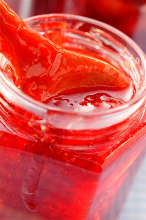 Strawberry jam in jar with wooden spoon Stock Photo - Premium Royalty-Free, Code: 659-01843961