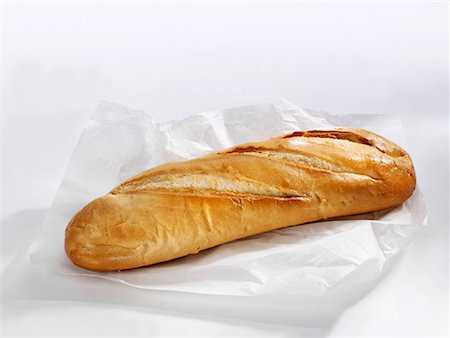 single loaf - A long white loaf on sandwich wrap Stock Photo - Premium Royalty-Free, Code: 659-01854278