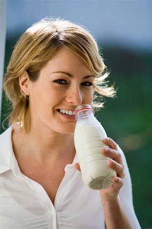 simsearch:659-03523361,k - Young woman drinking milk out of a bottle Stock Photo - Premium Royalty-Free, Code: 659-01854555