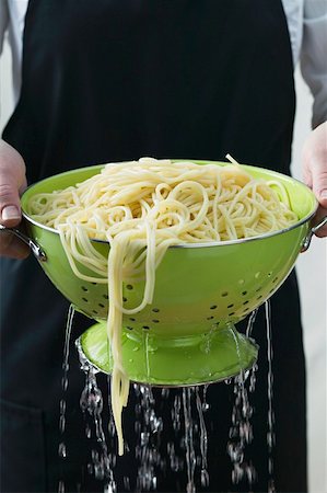 Freshly cooked spaghetti in a colander Stock Photo - Premium Royalty-Free, Code: 659-01854766