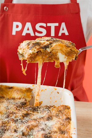 A portion of lasagne on a spatula Foto de stock - Sin royalties Premium, Código: 659-01854796