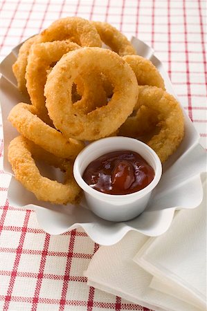 Squid rings in paper dish with dip Foto de stock - Sin royalties Premium, Código: 659-01854799