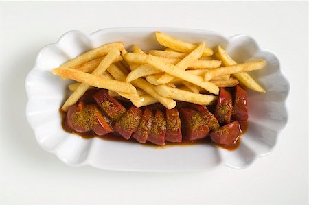 french fry top view nobody - Sausage, cut into slices, with ketchup and chips Stock Photo - Premium Royalty-Free, Code: 659-01854825