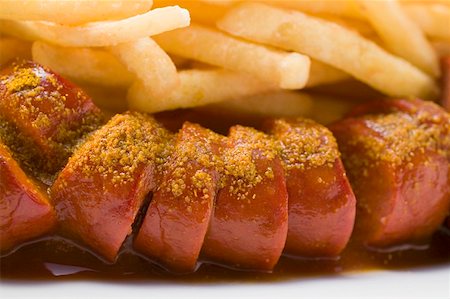 fried sausage - Sausage, cut into slices, with ketchup and chips Stock Photo - Premium Royalty-Free, Code: 659-01854826