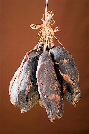 Smoked venison ham on a hook Stock Photo - Premium Royalty-Free, Code: 659-01854827