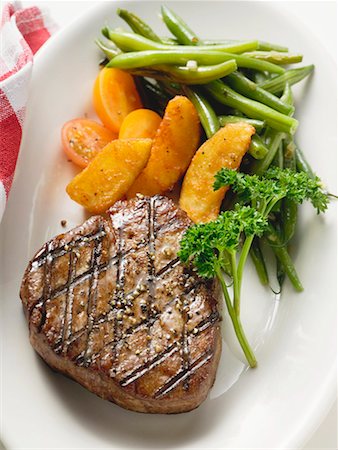 simsearch:659-06903102,k - Grilled fillet steak with country potatoes and bean salad Stock Photo - Premium Royalty-Free, Code: 659-01854892